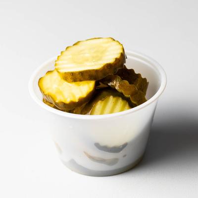 Pickles in a cup.