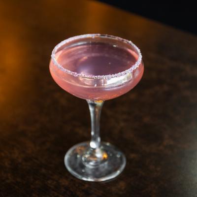 Prickly Pear Martini garnished with a sparkling sugar.