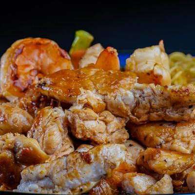 Grilled chicken and scallops, closeup.