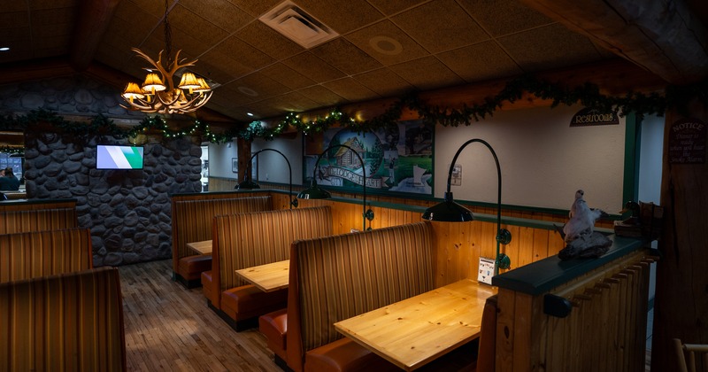 Cozy and intimate restaurant seating area with upholstered booths