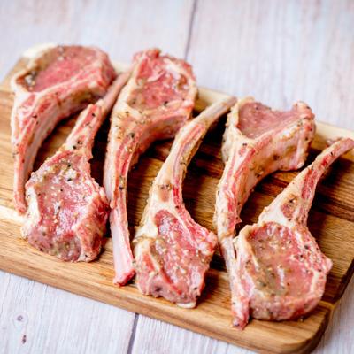 Raw marinated lamb chops.