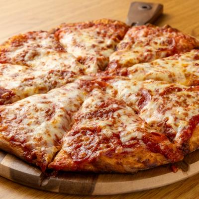 Pepperoni Pizza served on a rustic wooden pizza board.