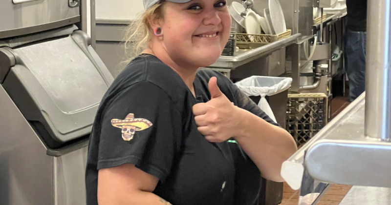 Employee giving thumbs up for the camera