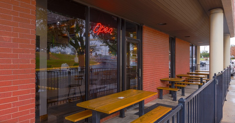 Exterior, patio with tables and benches