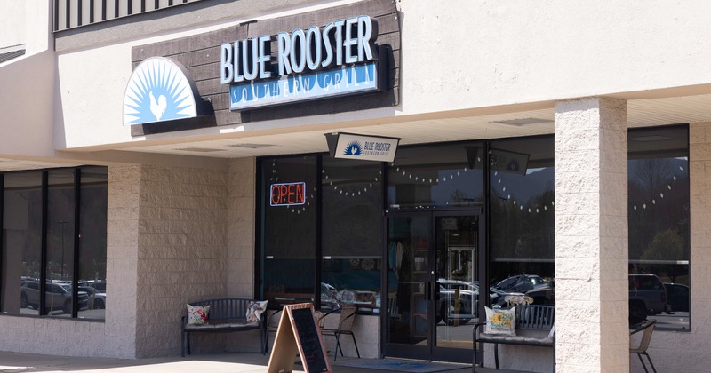 Exterior, side view to restaurant, entrance, sign above