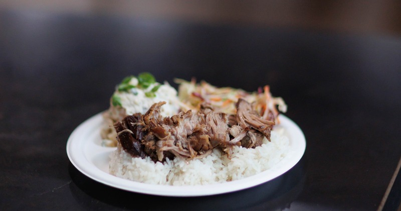 Pork served with rice and side dishe