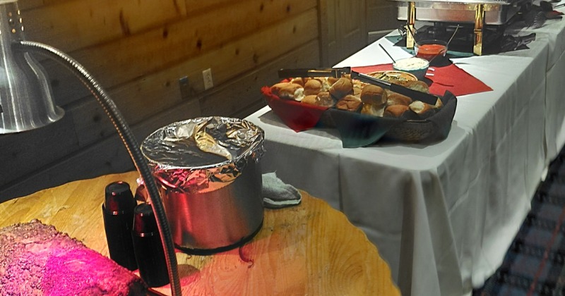 Banquet setup featuring a buffet-style table with multiple chafing dishes