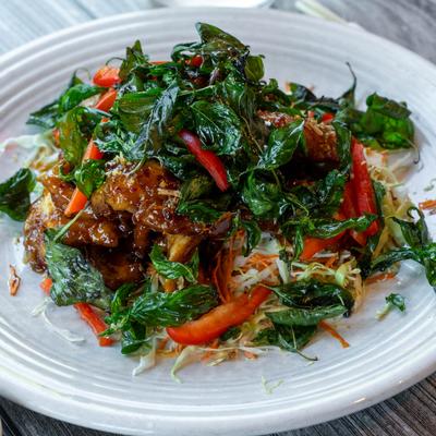 Stir fried chicken in sweet chili sauce, with veggies.