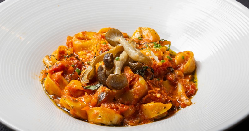 Pasta with mushrooms in tomato sauce