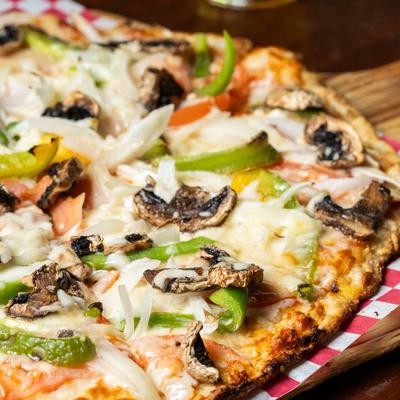 Veggie pizza, served, closeup.