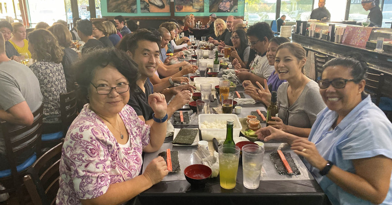 crowd at the table posing