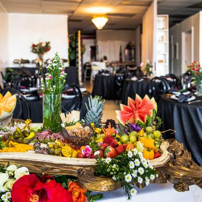 Charcuterie tray, dining area in the background.