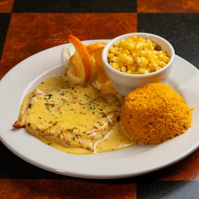 Grilled Orange Chicken served with sides of rice and sweet corn.