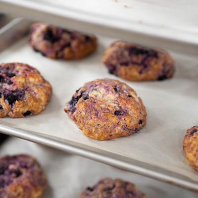 Blueberry drop scones on a baking sheet.