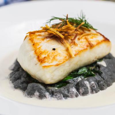 Pan Seared Halibut, served over cauliflower puree and sauteed spinach.