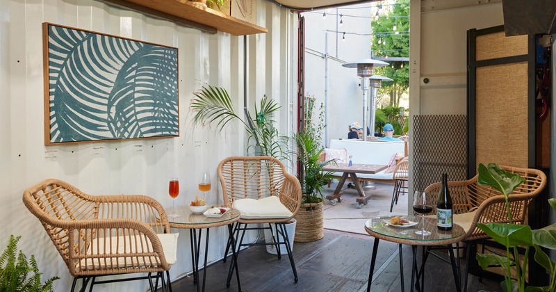 Interior seating space, picture on the wall and green plants