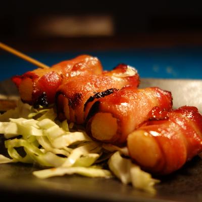 Bacon wrapped shrimp skewer, close up.