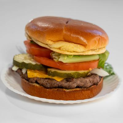 Super cheeseburger with lettuce, tomato, onion and pickles.