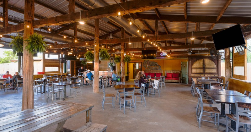 Interior, dining area with seated people enjoying their time