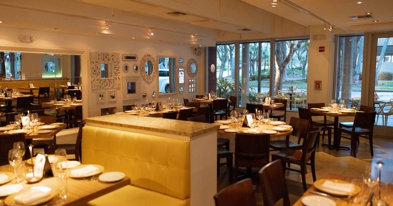 Interior, dining area with mirrors on the wall