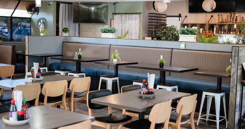 Interior, tables and chairs, banquette seating in the back