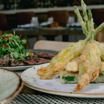 Fried endivia with pear, Gorgonzola, caramelized walnuts, and honey dressing.