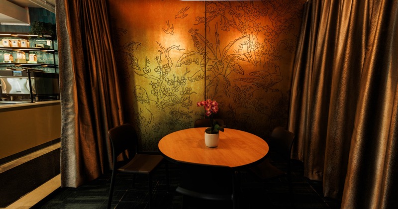 Interior, table with chairs, flowers on the table