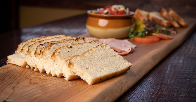 Pieces of bread on a wooden plate