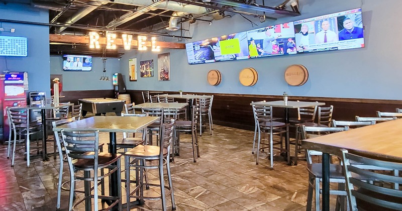 Interior, wide view, tables and chairs ready for guests