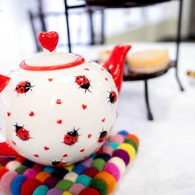 Tea pot on a cozy.