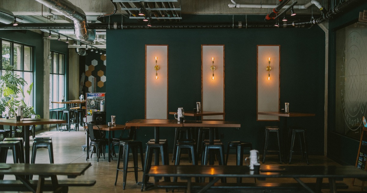 Seating area with bar tables and stools