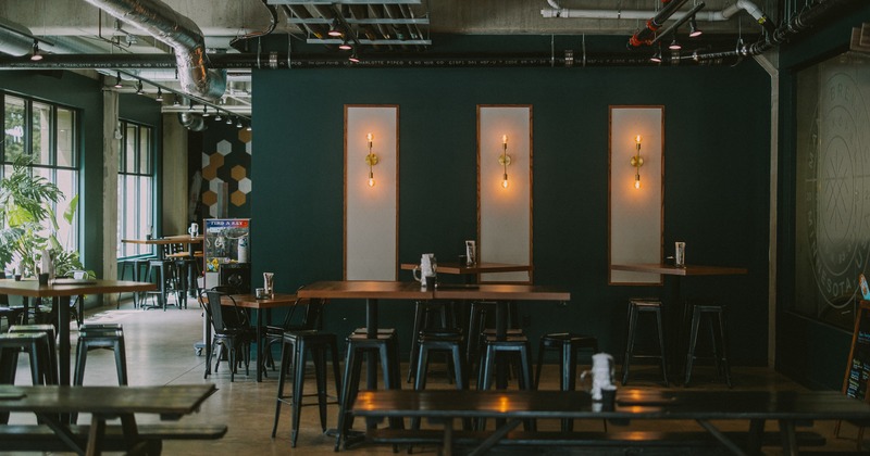 Seating area with bar tables and stools