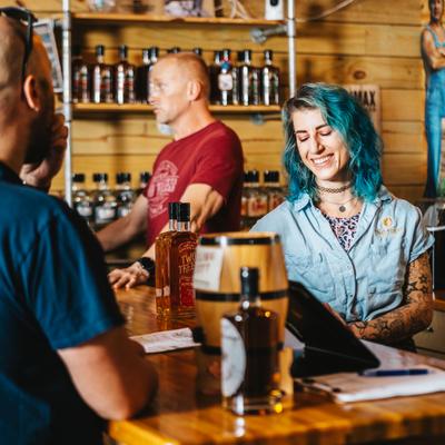 People smiling at the bar.