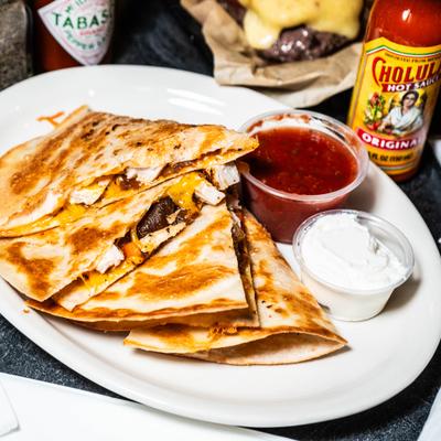 Chicken Quesadilla with homemade Salsa and Sour Cream.