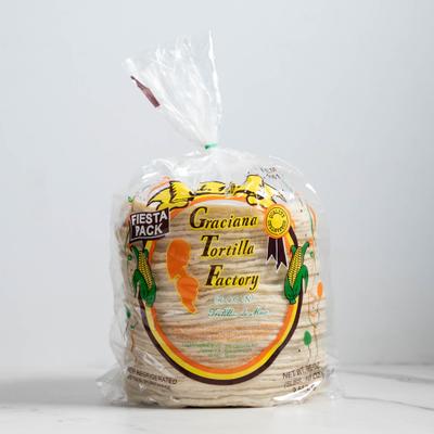 Stacked corn tortillas in a clear bag.