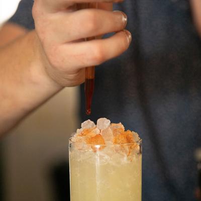 Staff member preparing cocktail