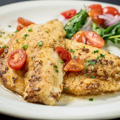 Breaded branzino fish fillet.