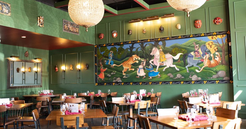 Dining area with mural on wall