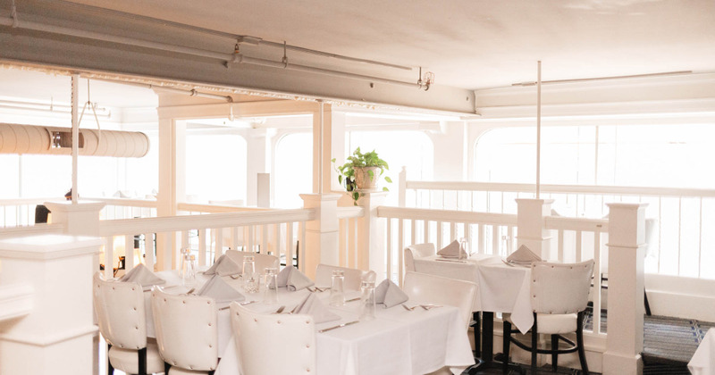 Upstairs interior, guest tables with tableware ready for guests