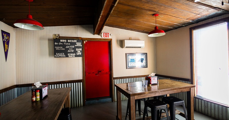 Red door entrance, diner table, chairs