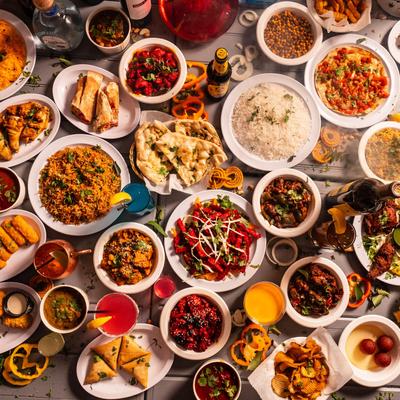 Assortment of dishes and drinks, large table spread, top view