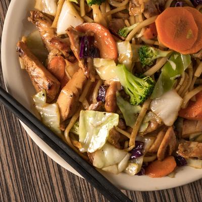 Chicken with stir-fried vegetables, noodles and special sauce.