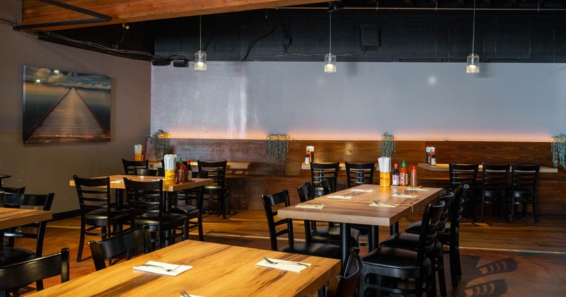 Interior seating area with wooden chairs and tables