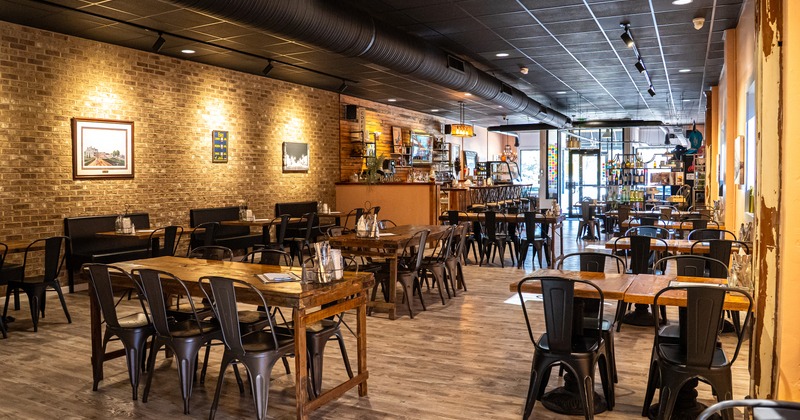 Warm and cozy rustic style restaurant interior dining area and bar area