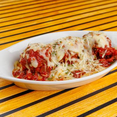 Scotty's Meatballs topped with house marinara sauce and melted cheese.