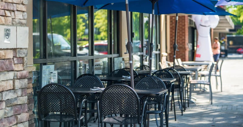 Outdoor, seating area with tables and chairs