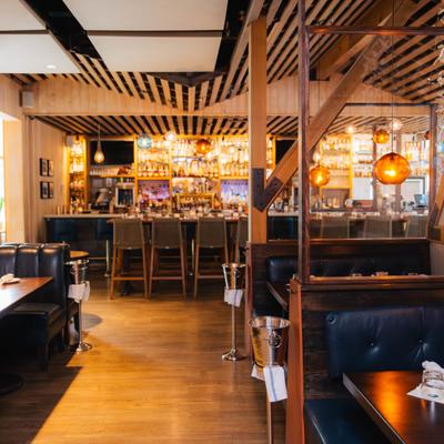 Interior, dining area, bar counter in the background.
