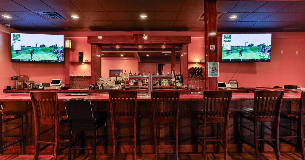 Bar area, stools, screens above