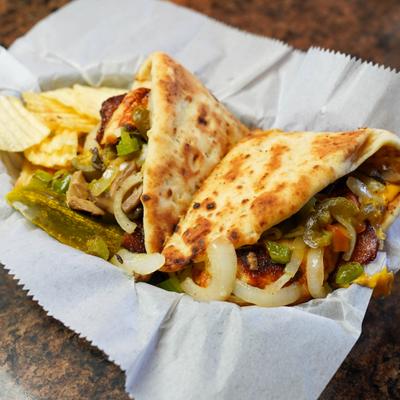 Grilled chicken sandwich with cheese, bacon, onions, peppers, mushrooms, and jalapenos.