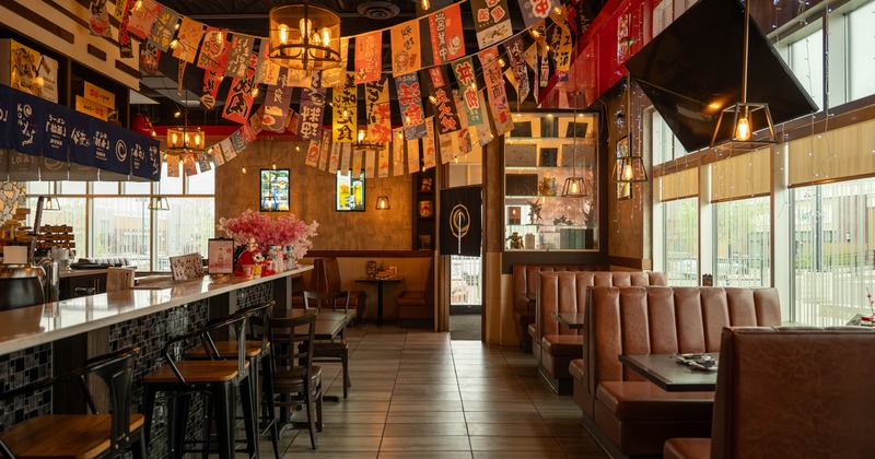 Interior, seating area with a bar on the left
